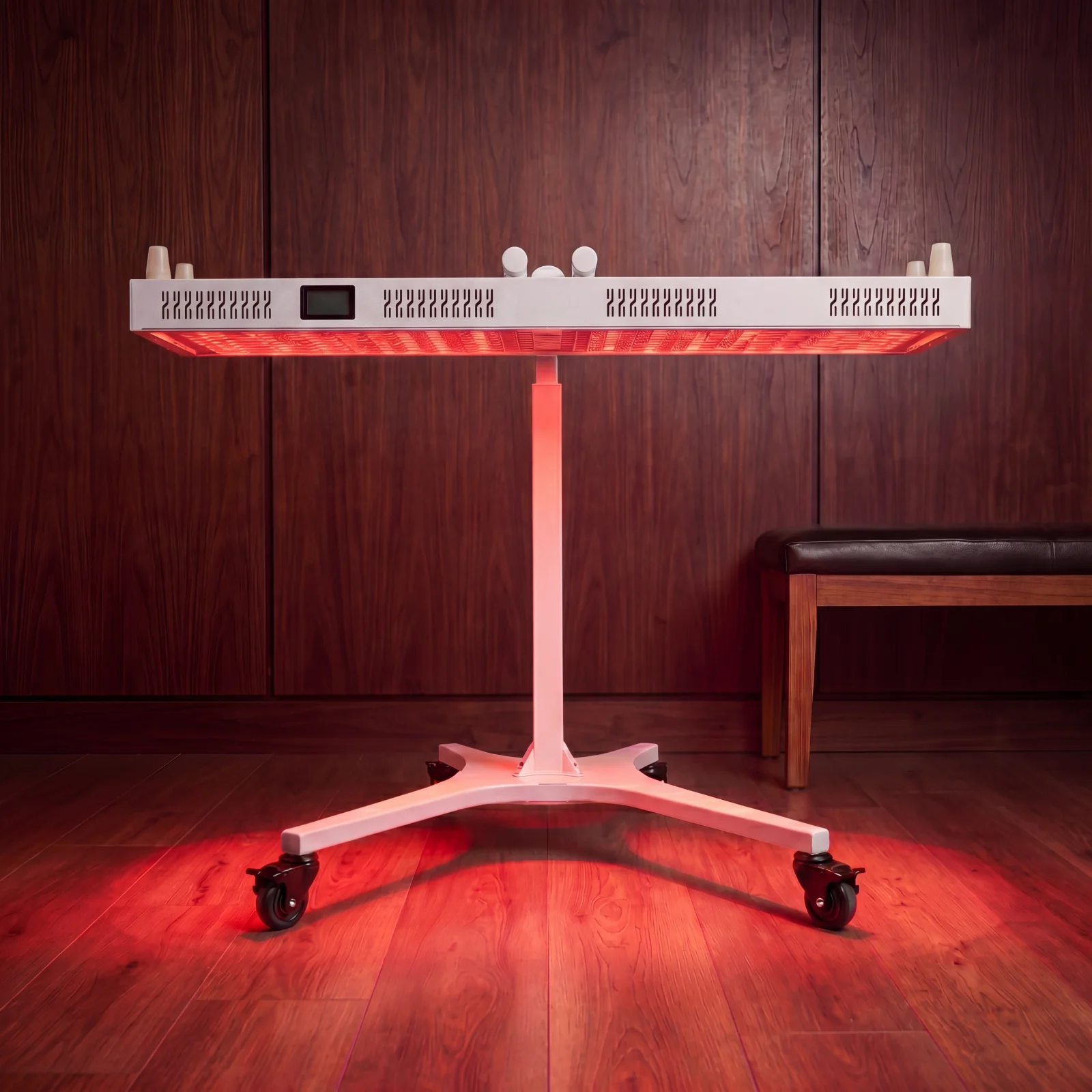 RLPRO 1200 mounted horizontally on the electric stand, powered on with red therapeutic glow