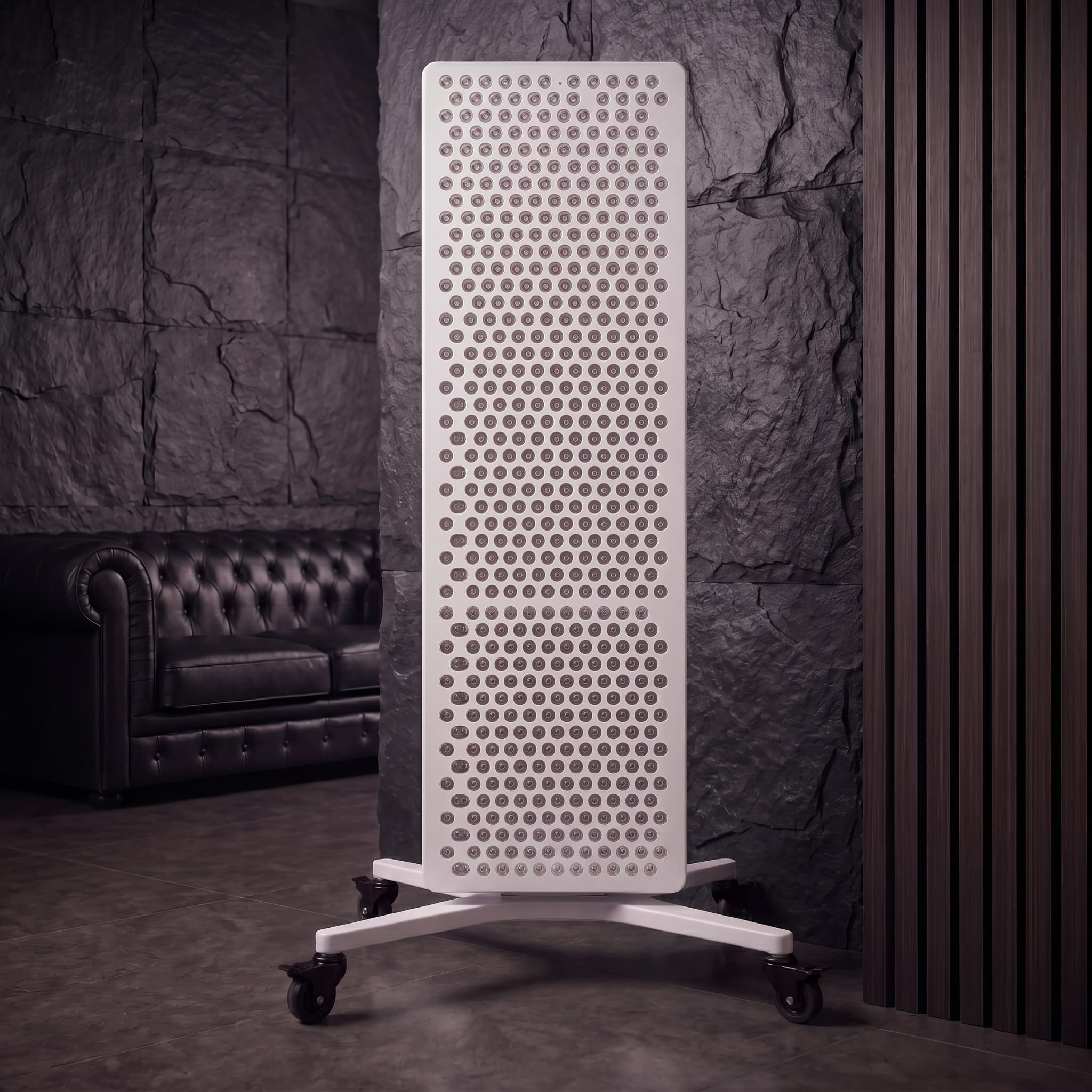 RLPRO 2000 mounted vertically on the white electric lifting stand, dead-on front view — dark slate stone environment, dense bullseye LED grid filling the wider-body face